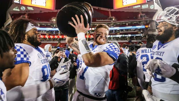 Kentucky quarterback Will Levis holds the Governor's Cup trophy after the Wildcats defeated Louisville 52-21 Saturday night. Nov. 27, 2021 Louisville Vs Kentucky 2021 Governors Cup